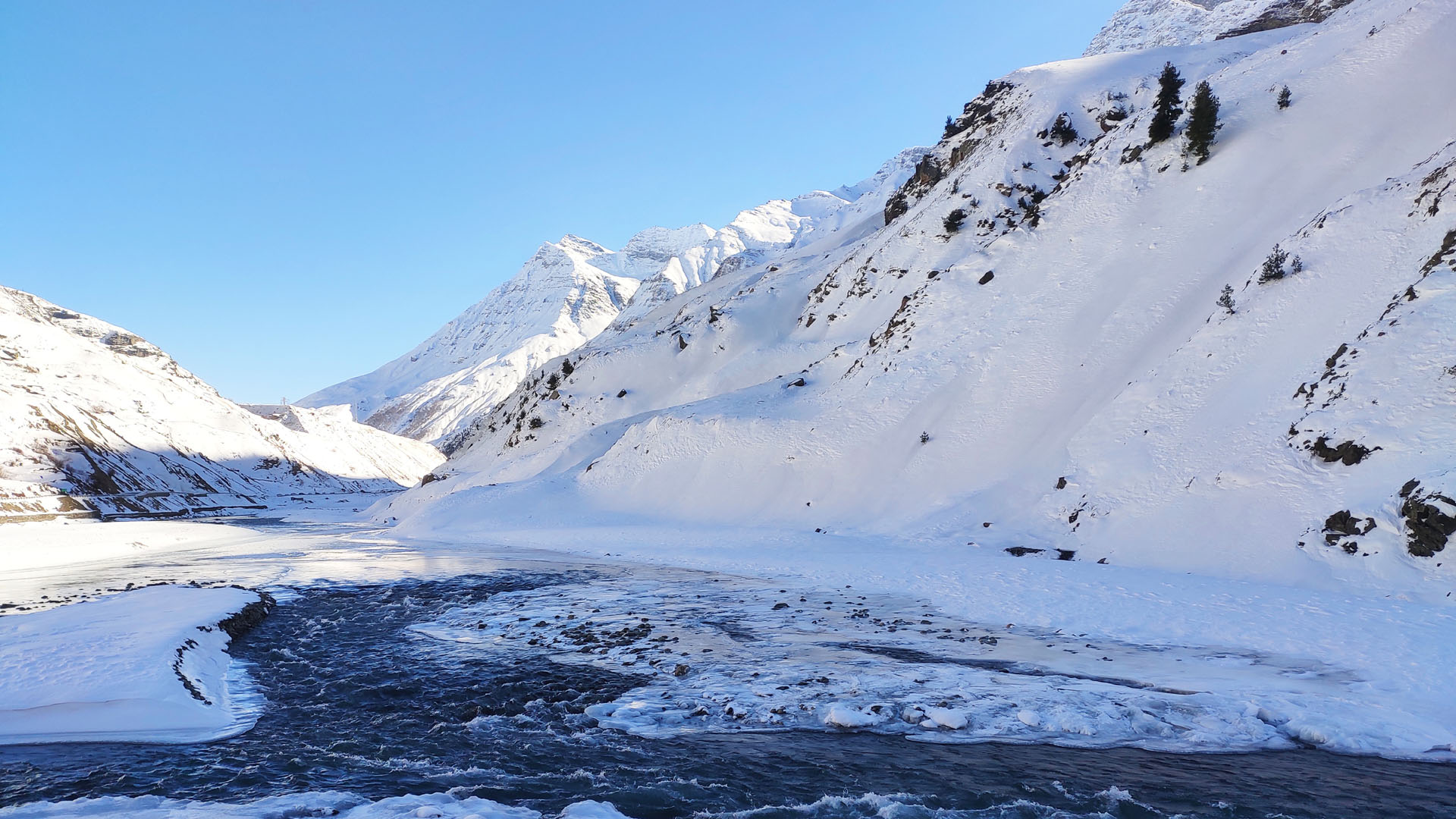 Snow covered view of Chandra River near North Portal Atal Tunnel Rohtang